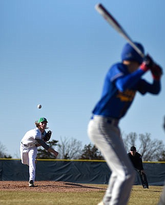 Parker Bax of Blair Oaks throws a pitch to Jaden Hoskins of Fatima on Monday at the American Legion Post 5 Sports Complex.