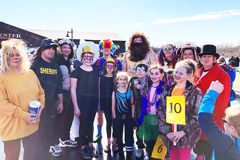 Polar plungers, including several deputies from the Callaway County Sheriff's Office, pose Saturday outside the Columbia Bass Pro Shop. The event raised funds for the Special Olympics of Missouri.