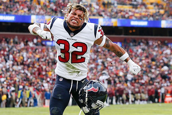 In this Nov. 18, 2018, file photo, Texans free safety Tyrann Mathieu celebrates strong safety Justin Reid's interception and touchdown during a game against the Redskins in Landover, Md.