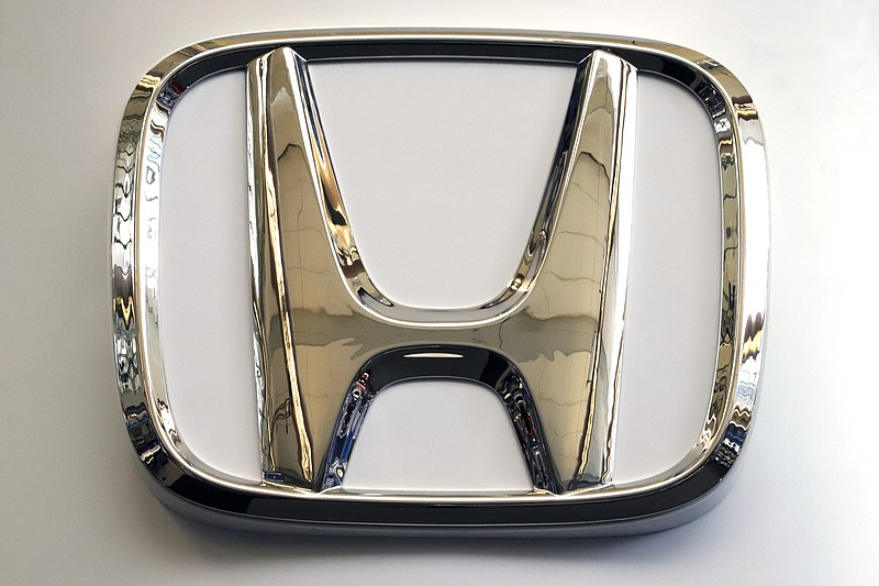In this Feb. 14, 2019, photo, this photo shows the Honda logo on a sign at the 2019 Pittsburgh International Auto Show in Pittsburgh. Honda will be recalling about 1 million older vehicles in the U.S. and Canada because the Takata driver's air bag inflators that were installed during previous recalls could be dangerous. Documents posted Monday, March 11, 2019, by Canadian safety regulators show that Honda is recalling many of its most popular models for a second time. (AP Photo/Gene J. Puskar)