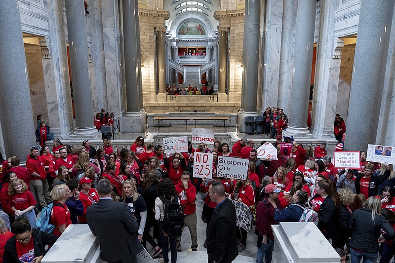 Teachers, and their supporters, gather outside the Senate Chambers in the Capitol to protest perceived attacks on public education, in Frankfort, Ky, Tuesday, March 12, 2019. Kentucky's largest school district is closed again as about one third of its teachers called in sick so they could protest at the state Capitol. (AP Photo/Bryan Woolston)