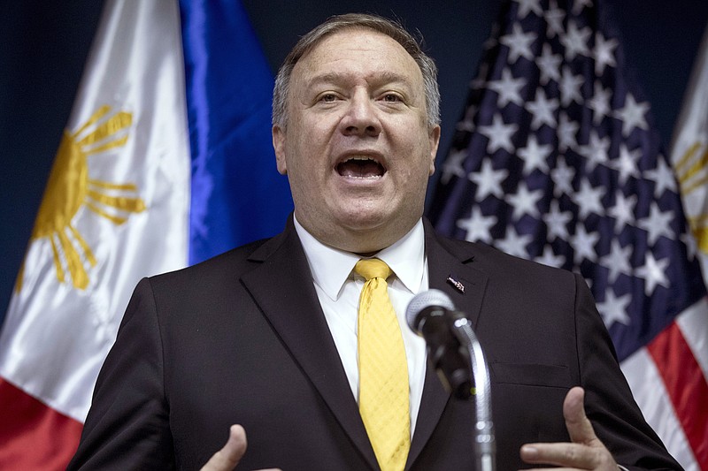 FILE - In this March 1, 2019, file photo, U.S. Secretary of State Mike Pompeo speaks during a news conference in Manila, Philippines. A seemingly belligerent tweet by Pompeo about pulling American diplomats out of Venezuela is the latest example of the Trump administration’s conflicting messages about its intentions, hinting at military involvement to some audiences while insisting that it has no intention of using force. (AP Photo/Andrew Harnik, Pool, File)