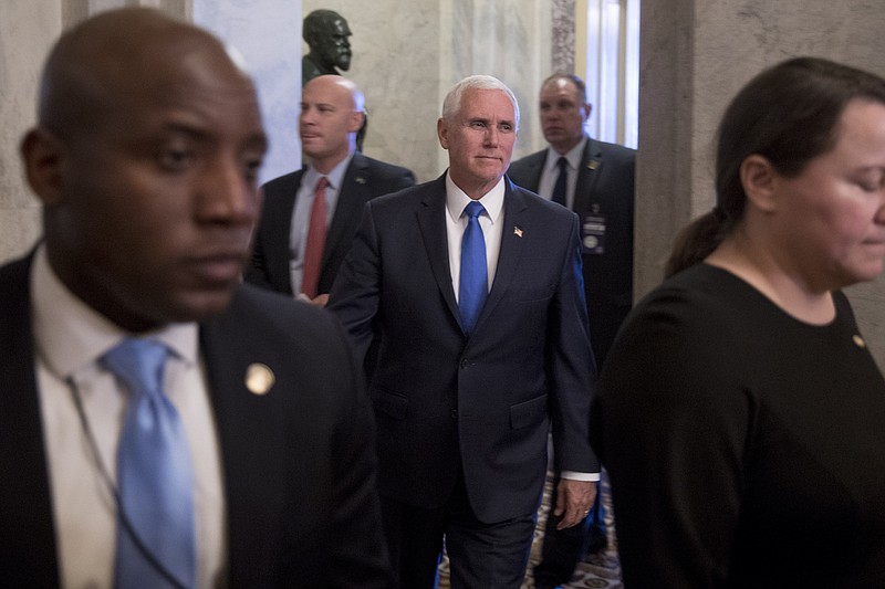 Vice President Mike Pence, center, accompanied by his Chief of Staff Marc Short, second from left, leaves the U.S. Capitol building on Capitol Hill in Washington, Tuesday, March 12, 2019. (AP Photo/Andrew Harnik)