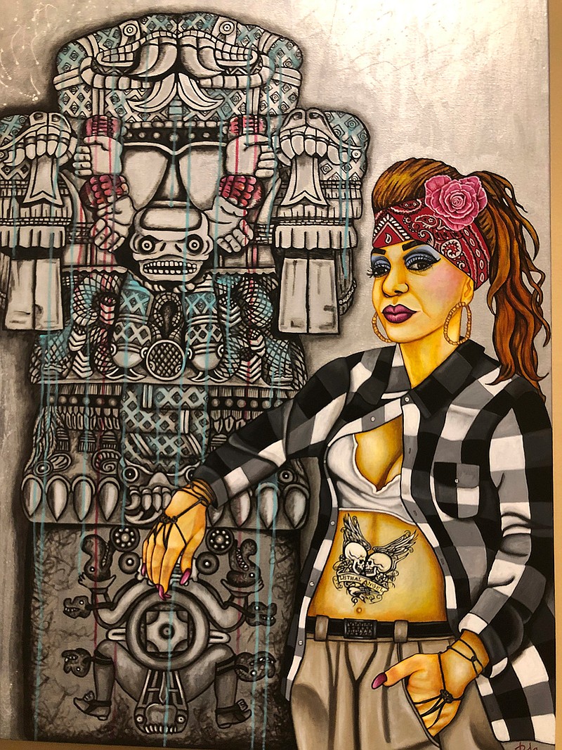 In this Wednesday, March 6, 2019 photo of the painting entitled "Coatlicue Lopez" by artist Pola Lopez hangs at the National Hispanic Cultural Center in Albuquerque, before the opening of a exhibit on the chola _ a working-class, Mexican-American female often associated with urban gangs. The "Que Chola Exhibition" opens on Friday, March 8, 2019, with pieces by artists from New Mexico, Arizona, California, Texas, and Colorado. (AP Photo/Russell Contreras)