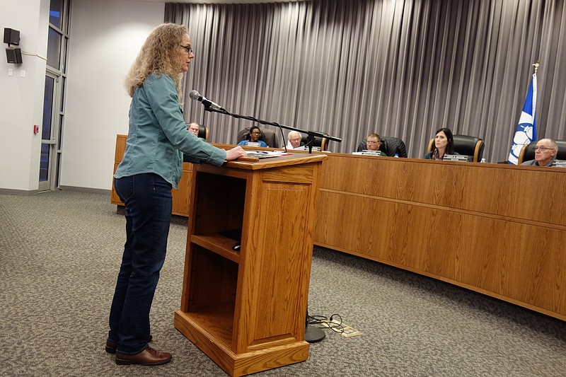 <p>Jenny Gray/FULTON SUN</p><p style="text-align:right;">Janea Danuser of Danuser Machine Co. in Fulton talks to members of the Fulton City Council on Tuesday about expansions being made and rezoning requests. Members of the council moved along rezoning of tracts of land at 205, 209, 308 and 310 Oak St. after public hearings. The final reading of the rezoning ordinances, from R-2 residential to M-1 manufacturing will happen at the next council meeting at 6:30 p.m. March 26. Another rezoning request that will enable the former George Washington Carver School to be made into senior apartments also received a public hearing and the ordinance was read twice, with the final reading of this also planned March 26.</p>