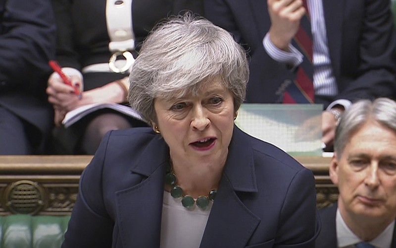 Britain's Prime Minister Theresa May speaks during Prime Minister's Questions inside the House of Commons in London, Wednesday March 13, 2019. Britain and the European Union seem braced Wednesday for a chaotic, cliff-edge Brexit, as Britain’s Parliament is set to hold further votes over the split with European Union.  (House of Commons/PA via AP)