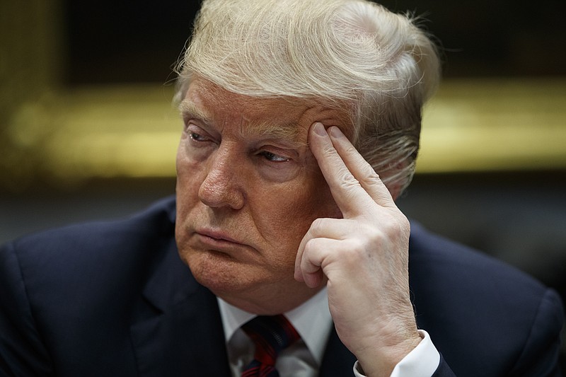 President Donald Trump listens during a briefing on drug trafficking at the southern border in the Roosevelt Room of the White House, Wednesday, March 13, 2019, in Washington. Trump said during the event the U.S. is issuing an emergency order grounding all Boeing 737 Max 8 and Max 9 aircraft "effective immediately," in the wake of the crash of an Ethiopian Airliner that killed 157 people. (AP Photo/Evan Vucci)
