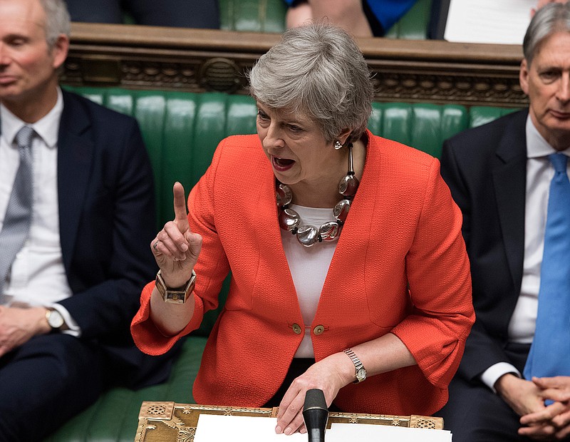 Britain's Prime Minister Theresa May gives a speech to a packed parliament Tuesday March 12, 2019. May keeps going, declining to resign, despite two successive parliamentary defeats of historic proportion and she is still pushing for her Brexit agreement, despite ample evidence that Parliament won't support it. (Jessica Taylor/UK Parliament via AP)