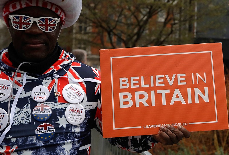 A pro-Brexit leave the European Union supporter takes part in a protest outside the House of Parliament in London, Wednesday, March 13, 2019. European Union officials on Wednesday criticized the U.K. Parliament for rejecting a Brexit deal for a second time as the bloc prepared for a chaotic, cliff-edge departure. (AP Photo/Kirsty Wigglesworth)