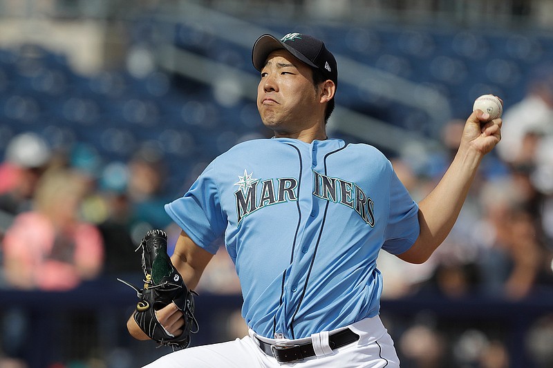  In this Monday, Feb. 25, 2019, file photo, Seattle Mariners' Yusei Kikuchi throws during the first inning of a spring training baseball game against the Cincinnati Reds in Peoria, Ariz. Kikuchi was determined from the time he was 15 years old to be the next great Japanese import to dazzle American fans and befuddle major league hitters. That dream is now the reality for the newest starting pitcher for the Mariners. (AP Photo/Darron Cummings, File)