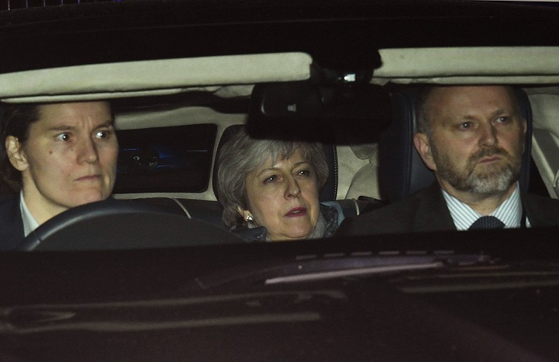 Britain's Prime Minister Theresa May leaves the Houses of Parliament in London, Thursday, March 14, 2019. Britain's Parliament voted Thursday to seek a delay of the country's departure from the European Union, a move that will likely avert a chaotic withdrawal on the scheduled exit date of March 29. (Victoria Jones/PA via AP)