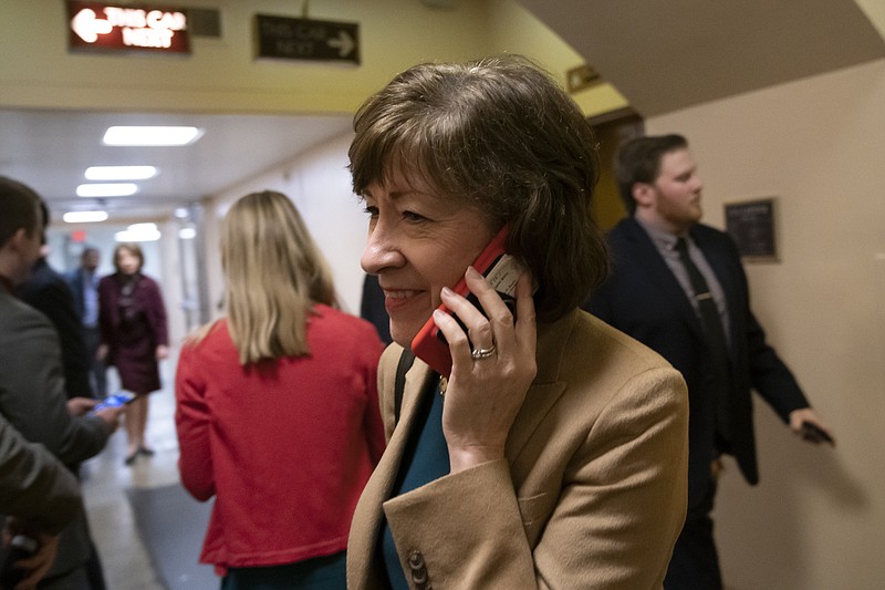 Sen. Susan Collins, R-Maine, arrives in the Senate where she has said she will vote for a resolution to annul President Donald Trump's declaration of a national emergency at the southwest border, on Capitol Hill in Washington, Thursday, March 14, 2019. (AP Photo/J. Scott Applewhite)