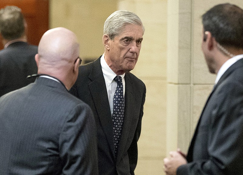 FILE - In this June 21, 2017 file photo, former FBI Director Robert Mueller, the special counsel probing Russian interference in the 2016 election, arrives on Capitol Hill for a closed door meeting before the Senate Judiciary Committee in Washington. U.S. special counsel Robert Mueller has yet to release his report about alleged Russian meddling in the 2016 U.S. presidential election but Moscow has already rehearsed its response, dismissing Mueller's investigation as part of the U.S. political infighting. (AP Photo/Andrew Harnik, File)