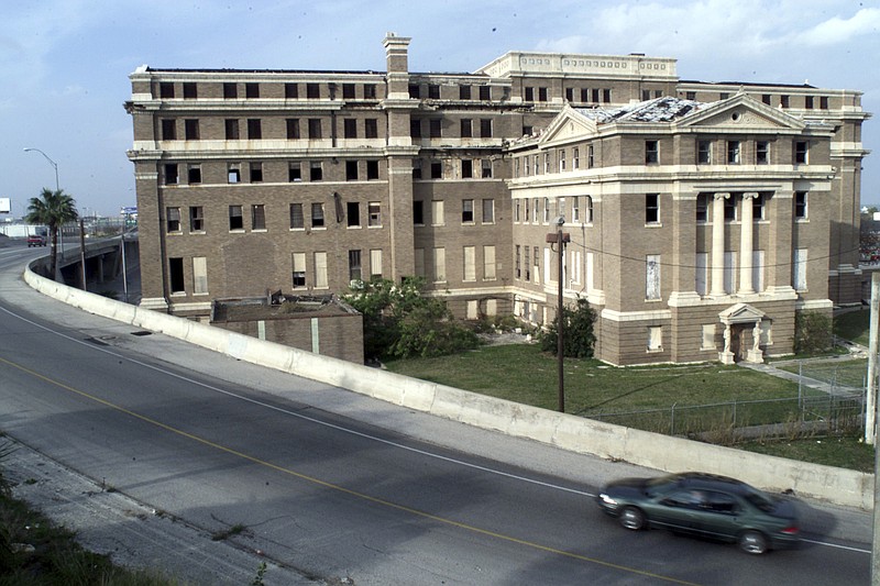 This undated file photo shows the old Nueces County courthouse in Corpus Christi, Texas. Leaders of the South Texas county have rejected a proposal to buy and demolish the historic courthouse built in 1914 but abandoned years ago and now in disrepair. Nueces County Commissioners on Wednesday, March 13, 2019, refused an offer from the Ed Rachal Foundation to pay $1.5 million in back taxes and other costs to demolish the structure.  (David Pellerin/Corpus Christi Caller-Times via AP, File)