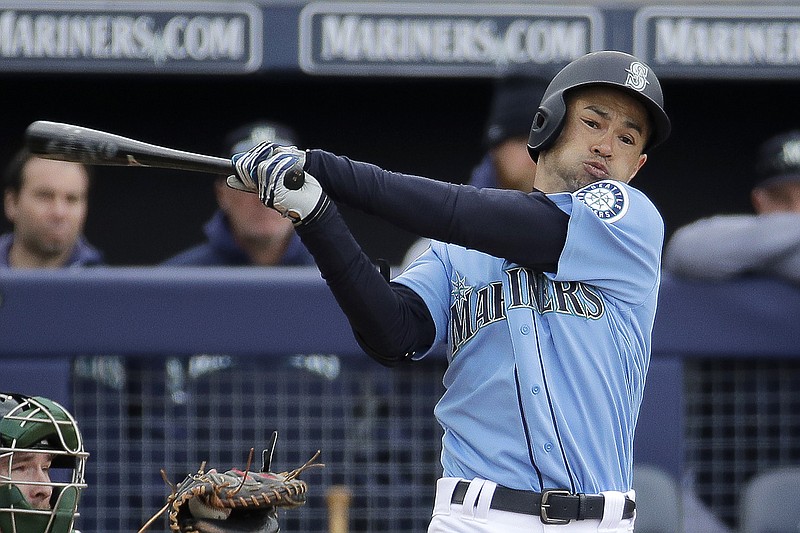 In this Friday, Feb. 22, 2019 file photo, Seattle Mariners' Ichiro Suzuki bats during the third inning of a spring training baseball game against the Oakland Athletics in Peoria, Ariz. Jerry Dipoto's first introduction to the world of Ichiro Suzuki was only a small taste compared to what the Seattle Mariners are about to experience when they open the season in Tokyo with a pair of games against the Oakland Athletics. The most decorated player ever to export his talents from Japan to the major leagues is returning home for what could be a farewell to his Hall of Fame career on both sides of the Pacific. His teammates can't wait. (AP Photo/Charlie Riedel, File)