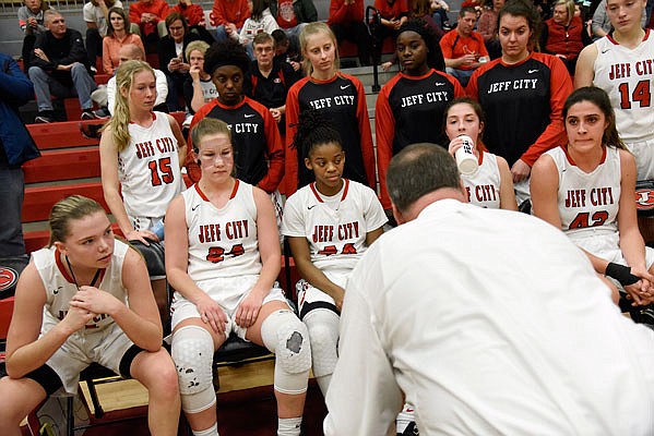 The Lady Jays listen to coach Brad Conway during a timeout in a game this season against Miller Career at Fleming Fieldhouse. Jefferson City will face Parkway Central this afternoon in the Class 5 semifinals in Springfield.