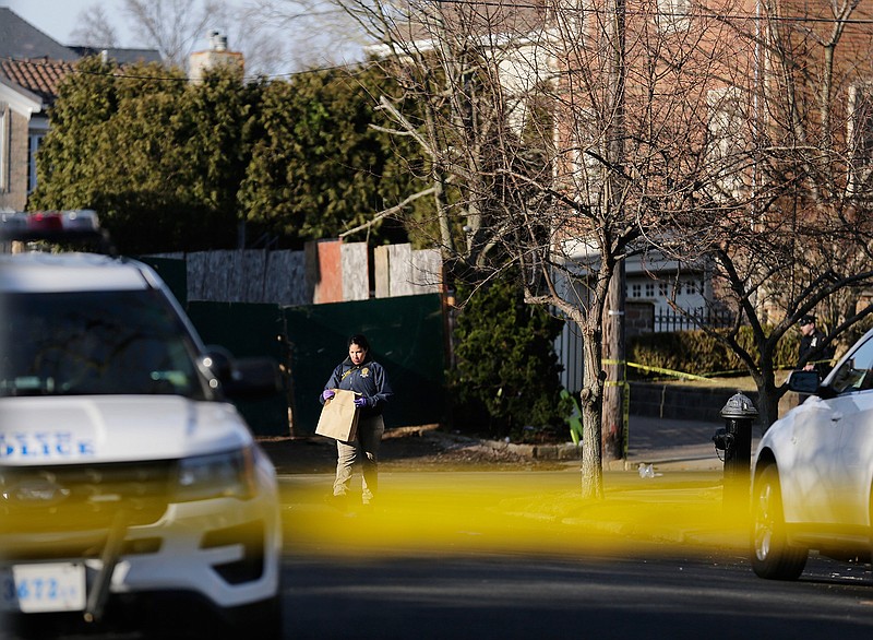 Police work near the scene where an alleged leader of the Gambino crime family was shot and killed in the Staten Island borough of New York, Thursday, March 14, 2019.  Francesco "Franky Boy" Cali, 53, was found with multiple gunshot wounds to his body at his home Wednesday night.  (AP Photo/Seth Wenig)