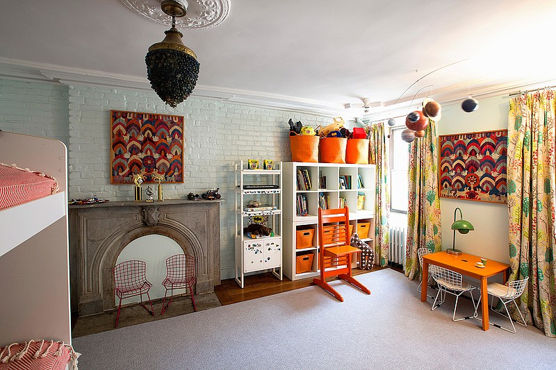 This photo provided by New York-based interior designer Fawn Galli shows a child's bedroom designed by Galli in the Brooklyn borough of New York. Storage baskets located at a child's level can help keep children's bedrooms organized and clutter-free. (Costas Picadas/Fawn Galli via AP)