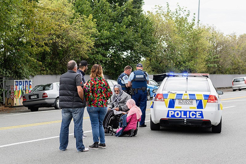 Members of the public react in front of the Masjd Al Noor Mosque as they fear for their relatives on March 15, 2019 in Christchurch, New Zealand. 49 people have been confirmed dead and more than 20 are injured following attacks at two mosques in Christchurch. Four people are in custody following shootings at Al Noor mosque on Dean's Road and the Linwood Masjid in Christchurch. Mosques across New Zealand have been closed and police are urging people not to attend Friday prayers as a safety precaution. (Kai Schwoerer/Getty Images/TNS)