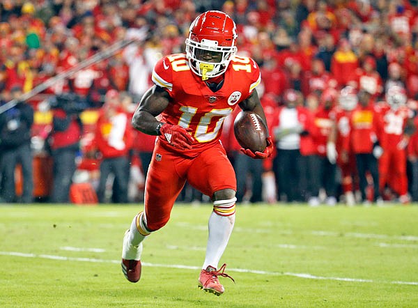 In this Dec. 13, 2018, file photo, Chiefs wide receiver Tyreek Hill runs with the ball during the first half of a game against the Chargers in Kansas City. The Chiefs are investigating an incident in which Hill was involved in a domestic battery episode in suburban Kansas City earlier this week.