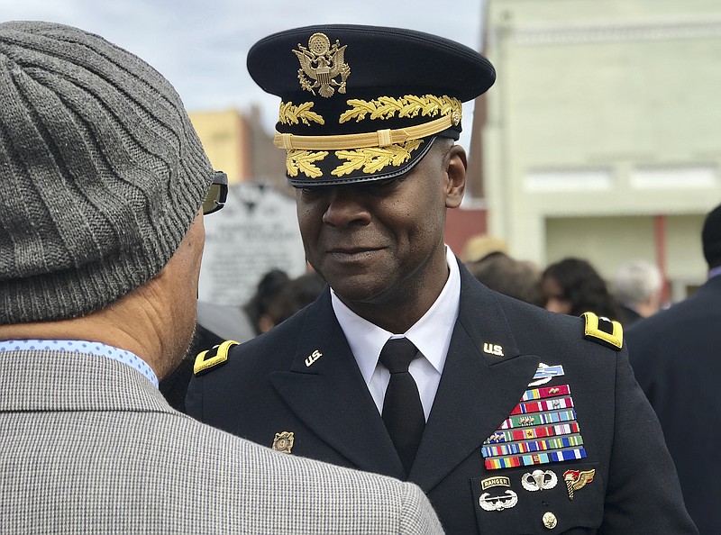 In this Feb. 9, 2019 photo, Brig. Gen. Milford H. Beagle, Jr. commanding general of Fort Jackson, speaks to the president of the Sgt. Isaac Woodard Historical Marker Association following the dedication ceremony in Batesburg-Leesville, S.C.   Beagle, Jr. who now leads the Army's Fort Jackson in South Carolina is descended from a soldier who served there in a segregated military more than a century ago. (AP Photo/Christina Myers)