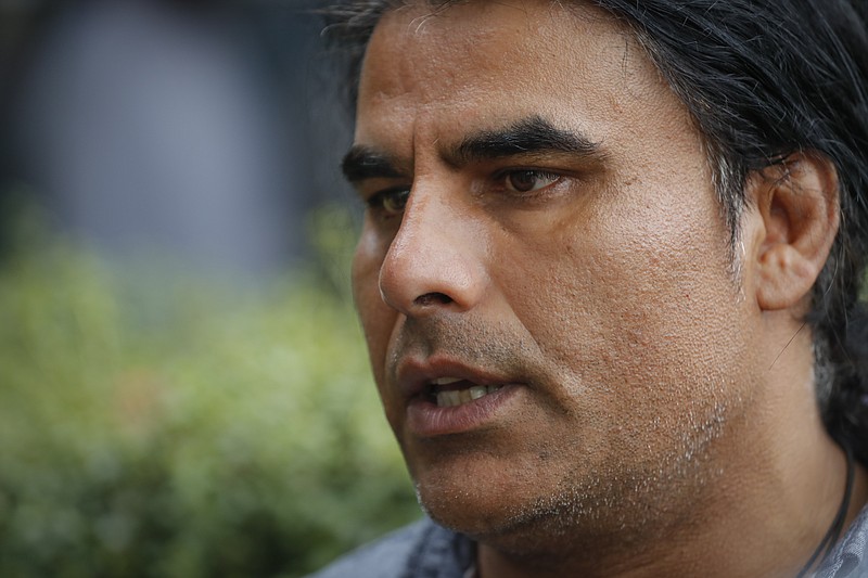 Abdul Aziz, survivor of mosque shooting speaks to Associated Press during an interview in Christchurch, New Zealand, Saturday, March 16, 2019. Aziz, 48, is being hailed as a hero for preventing more deaths during Friday prayers at the Linwood mosque in Christchurch. The gunman killed 49 people after attacking two mosques in the deadliest mass shooting in New Zealand’s modern history. Seven were killed at the Linwood mosque. (AP Photo/Vincent Thian)
