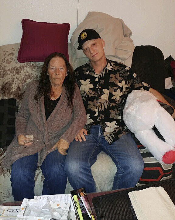 In this 2018 photograph released by lawyer Mark Zaid, Michael R. White, right, is seen with his mother, Joanne White, left. White, a U.S. Navy veteran from California, has been sentenced to 10 years in prison in Iran, his lawyer said Saturday, March 16, 2019, becoming the first American known to be imprisoned there since President Donald Trump took office. (White family via AP)