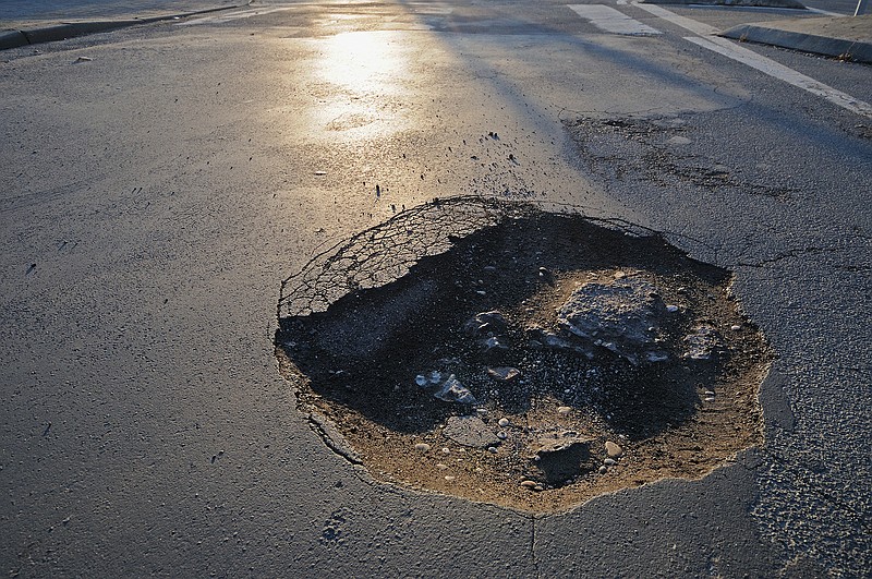 Slingshot effect? What happens when a car hits a pothole. (Dreamstime/TNS)