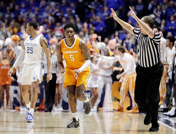 Tennessee guard Admiral Schofield celebrates as he runs down the court after making a 3-point basket against Kentucky in the second half of Saturday's semifinal game at the Southeastern Conference Tournament in Nashville, Tenn. Tennessee won 82-78.