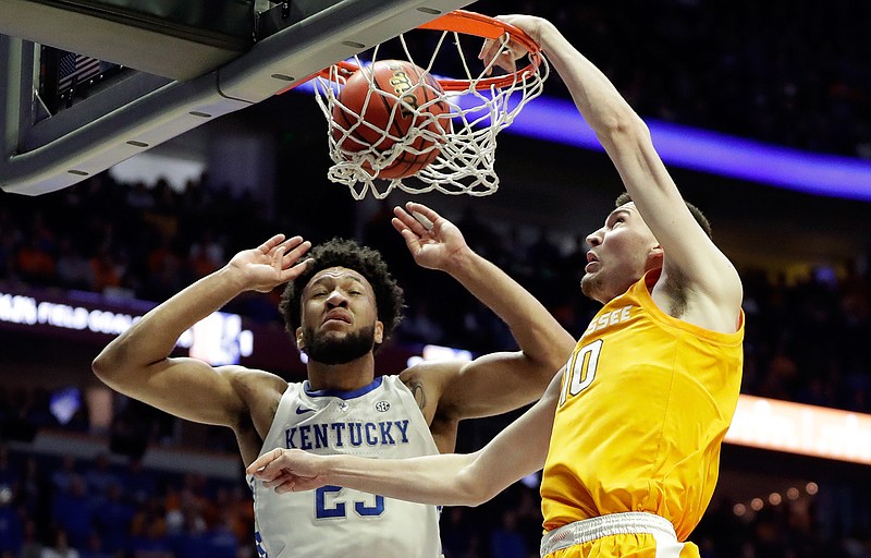 Tennessee forward John Fulkerson (10) dunks against Kentucky forward EJ Montgomery (23) in the first half of an NCAA college basketball game at the Southeastern Conference tournament Saturday, March 16, 2019, in Nashville, Tenn. (AP Photo/Mark Humphrey)