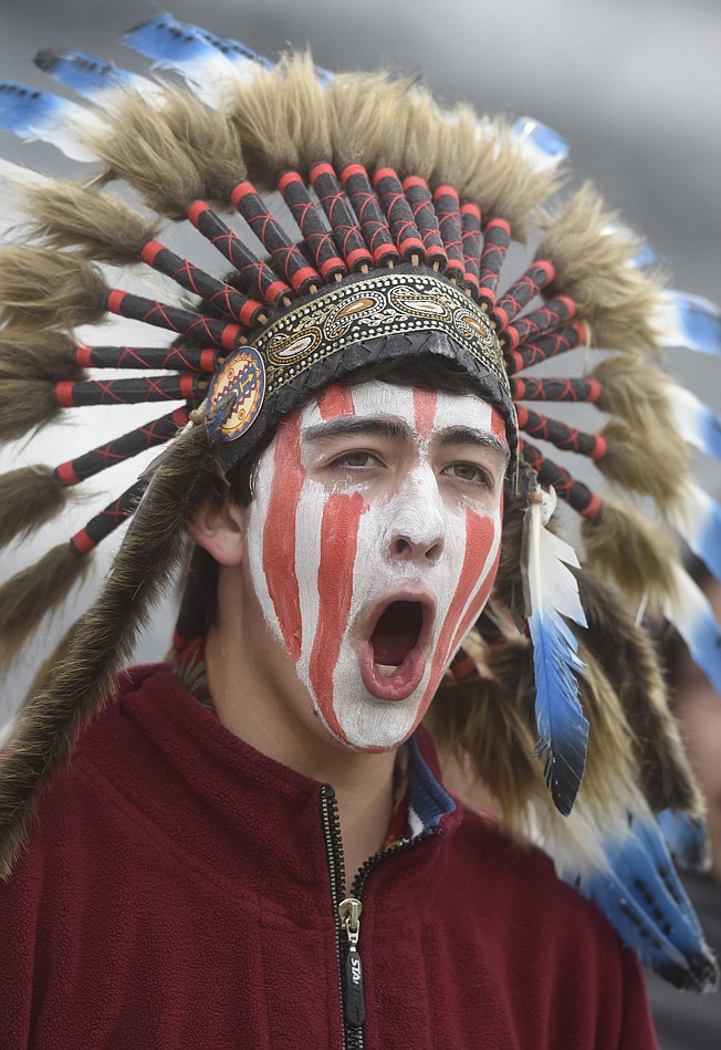 A Cheyenne Mountain High School student wears a headdress and face paint May 20, 2015, as he cheers for his school, which uses "Indians" as its team mascot, in the 4A State Soccer Championship game at Dick's Sporting Goods Park in Commerce City, Colo. 