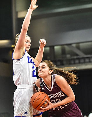 Missouri State's Alexa Willard drives to the basket against Drake's Hannah Fuller during Sunday afternoon's Missouri Valley Conference Tournament championship game in Moline, Ill.