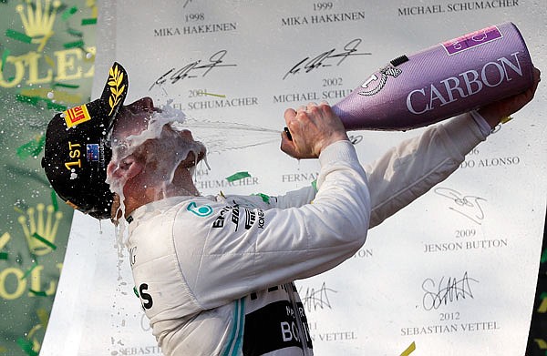 Valtteri Bottas sprays himself with champagne Sunday after winning the Australian Formula 1 Grand Prix in Melbourne, Australia.