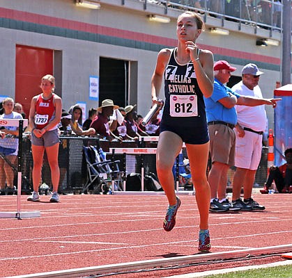 Emma Veltrop of Helias runs during the 4x800-meter relay during the Class 4 state championships last year at Adkins Stadium.