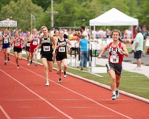 Emma Homfeldt of Calvary Lutheran leads the field to the finish line on her way to winning the Class 1 800-meter run state title last season at Adkins Stadium.