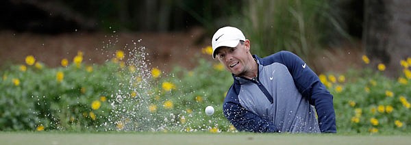 Rory McIlroy blasts a shot out of the bunker to the 14th green during Sunday's final round of The Players Championship in Ponte Vedra Beach, Fla.