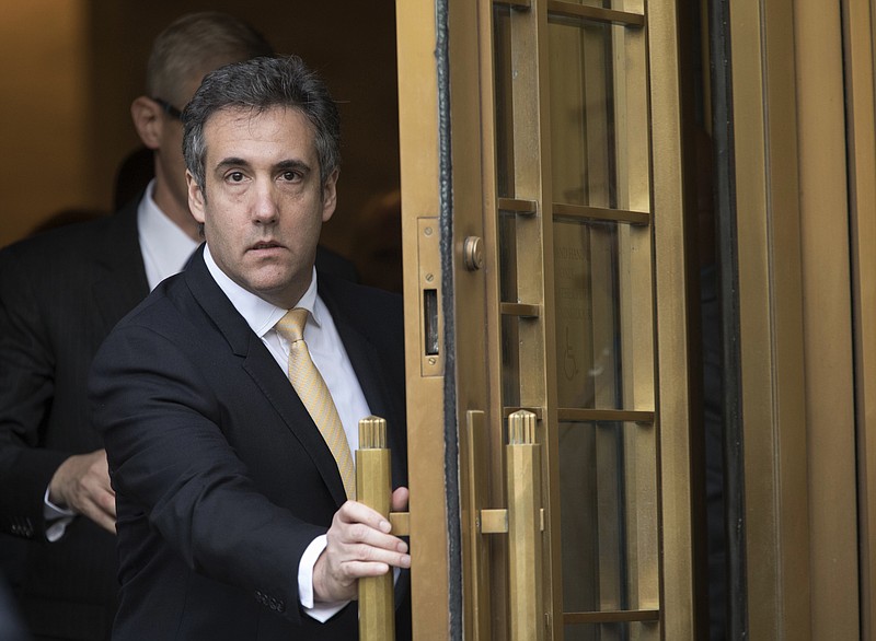FILE - In this Aug. 21, 2018, file photo, Michael Cohen leaves Federal court, in New York. Newly released documents show the FBI was investigating President Donald Trump's former personal attorney and fixer for nearly a year before agents raided his home and office. A search warrant released Tuesday, March 19, 2019 shows the federal inquiry into Cohen had been going on since July 2017,  far longer than had previously been known. (AP Photo/Mary Altaffer, File)