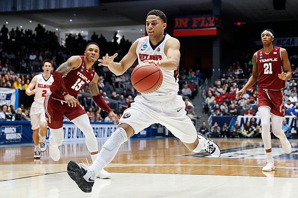 Belmont's Kevin McClain drives to the basket during the first half of Tuesday night's First Four game against Temple in Dayton, Ohio.