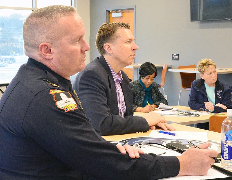 Jefferson City Police Department Capt. Eric Wilde and Cole County Associate Circuit Court Judge Cotton Walker engage with the public March 20, 2019, during a listening session at The Linc on crime issues. After several violent crimes occurred in Jefferson City late last year, community members have called for more to be done to address criminal activity. 