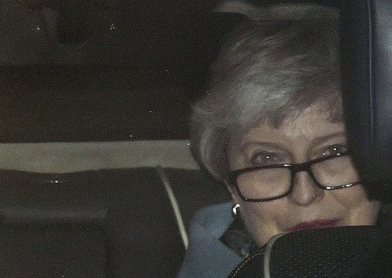 Britain's Prime Minister Theresa May arrives at the Houses of Parliament, in London, Wednesday March 20, 2019. Exactly 1,000 days after Britain voted to leave the European Union, and nine days before it is scheduled to walk out the door, May hit the pause button Wednesday, asking the bloc to postpone the U.K.'s departure until June 30. (Victoria Jones/PA via AP)