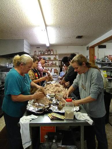 In this July 2018 file photo, volunteers prepare meals at Manna Kitchen in New Boston, Texas. Manna Kitchen is a nonprofit organization that serves meals to senior citizens and disabled people and is operated by Chapel of Light Church. The longtime ministry will be shut down by the church on Friday. (Submitted photo)
