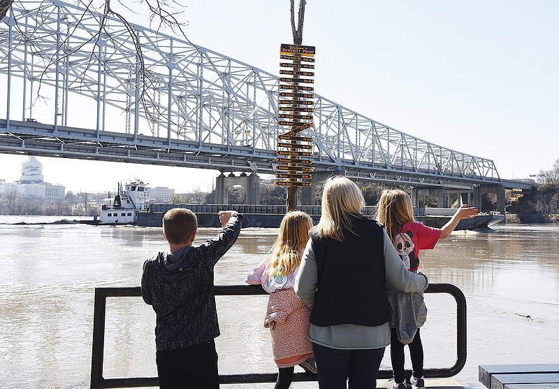 Grace Hoffmann brought her grandchildren to the Noren Missouri River Access in North Jefferson City on Monday, March 18, 2019, to witness the high water level. The children are, from left, Colton Hoffmann and his sisters Taylor and Kinley Hoffmann, 10, 8 and 5, respectively. 