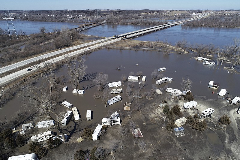 This Wednesday, March 20, 2019 aerial photo shows flooding near the Platte River in in Plattsmouth, Neb., south of Omaha. The National Weather Service is warning that flooding in parts of South Dakota and northern Iowa could soon reach historic levels. A Weather Service hydrologist says "major and perhaps historic" flooding is possible later this month at some spots on the Big Sioux and James rivers. The worst of the flooding so far has been in Nebraska, southwestern Iowa and northwestern Missouri. (DroneBase via AP)