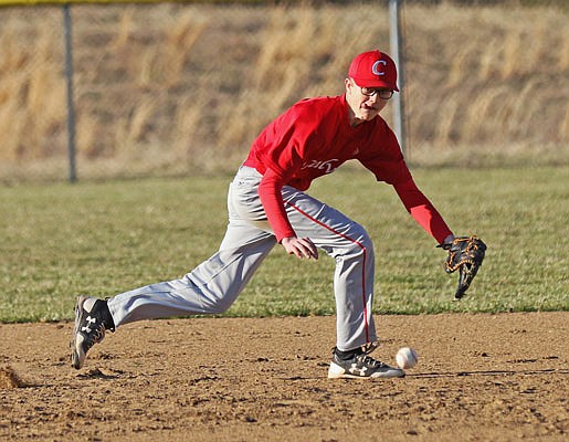 Calvary Lutheran shortstop Jonathan Lieb tracks a ground ball during Thursday's game against Bunceton at Calvary.