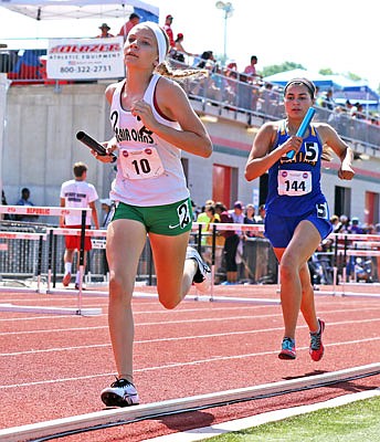 Natalie Heckman of Blair Oaks runs in the girls 4x800-meter relay in the Class 3 state track and field championships at Adkins Stadium.