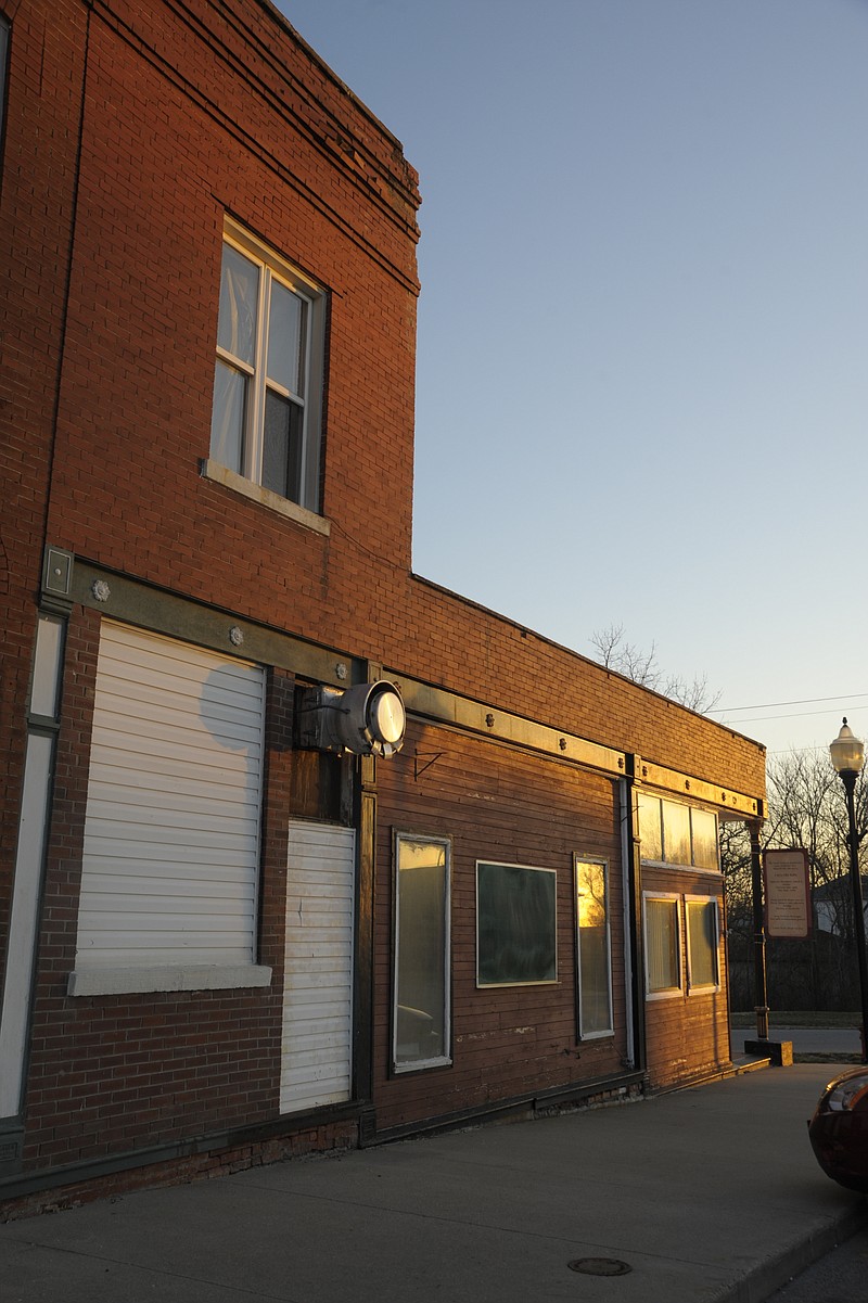 <p>Danisha Hogue/News Tribune</p><p>Bricks falling from a building on Railroad Avenue in Russellville have the sidewalk blocked off until further notice.</p>