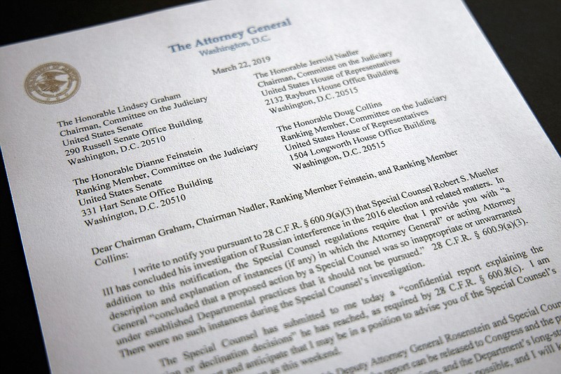A copy of a letter from Attorney General William Barr advising Congress that Special Counsel Robert Mueller has concluded his investigation, is shown Friday, March 22, 2019 in Washington.  Robert Mueller on Friday turned over his long-awaited final report on the contentious Russia investigation that has cast a dark shadow over Donald Trump's presidency, entangled Trump's family and resulted in criminal charges against some of the president's closest associates. (AP Photo/Jon Elswick)