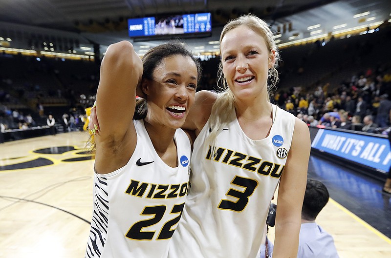 Missouri teammates Jordan Roundtree left) and Sophie Cunningham walk off the court after Friday's 77-76 overtime win against Drake in the NCAA Tournament in Iowa City, Iowa.