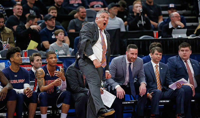 Auburn coach Bruce Pearl reacts during the first half of the team's second-round game against Kansas in the NCAA Tournament on Saturday in Salt Lake City.