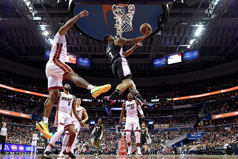 Washington Wizards guard Bradley Beal (3) goes to the basket against Miami Heat forward James Johnson, left, during the second half of an NBA basketball game, Saturday, March 23, 2019, in Washington. The Heat won 113-108. (AP Photo/Nick Wass)